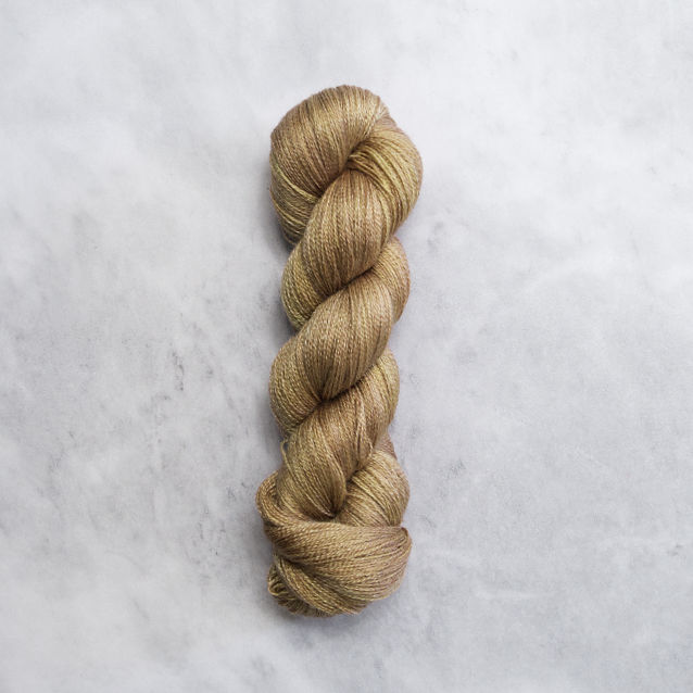 Yellowish brown skein of yarn with silver shimmer.