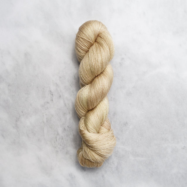 Golden yellow skein of yarn with silver shimmer.